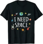 Black T-shirt featuring colorful space illustrations including planets, rockets, and stars with the text "I Need Space" for science and astronomy enthusiasts.