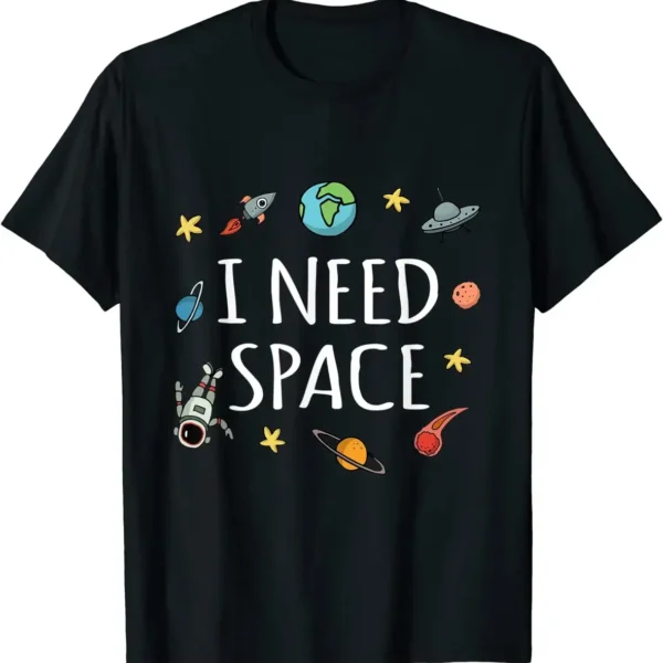 Black T-shirt featuring colorful space illustrations including planets, rockets, and stars with the text "I Need Space" for science and astronomy enthusiasts.