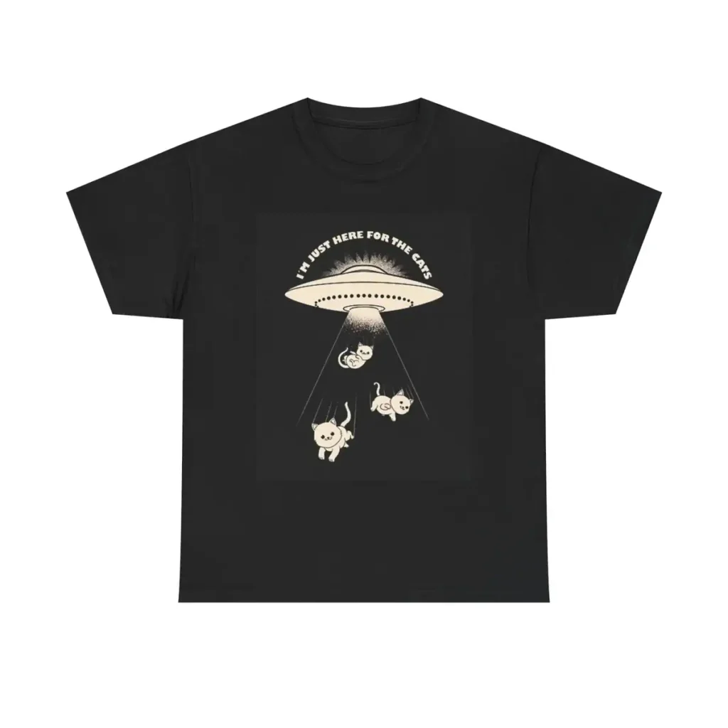 Black T-shirt featuring a UFO beaming up three cats with the text "I must here for the cats" above the UFO.