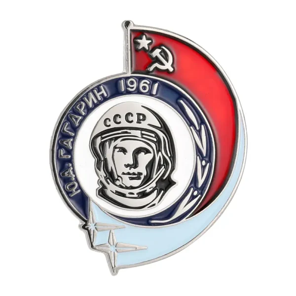 Vintage Soviet USSR badge featuring a cosmonaut's face with "CCCP" and "1961" inscriptions, surrounded by a red flag with a hammer and sickle symbol, and a stylized rocket.