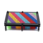 Magnetic pattern building board with colorful magnetic sticks arranged in various geometric designs, ideal for educational and creative activities.