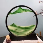 Sand Art Mountain Landscape in a Circular Frame.