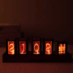 Illuminated flip clock displaying the year 2022 with glowing orange numbers.