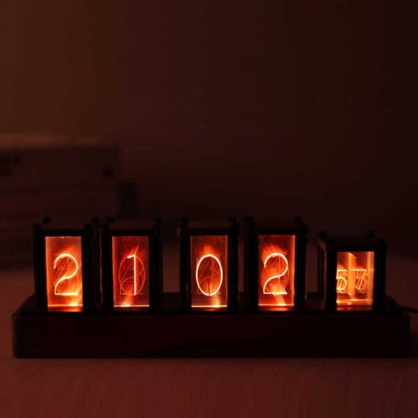 Illuminated flip clock displaying the year 2022 with glowing orange numbers.