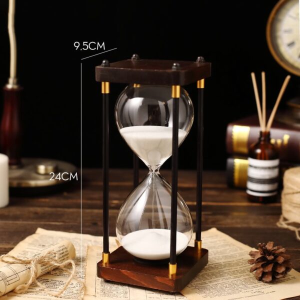 Classic wooden hourglass with white sand, measuring 24cm tall and 9.5cm wide, perfect for home decor or educational purposes.