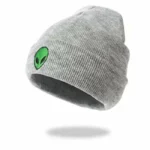 Comfortable gray beanie with a cute green alien face embroidery, perfect for science-themed fashion or casual wear.