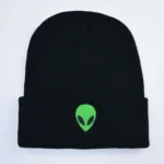 Black beanie hat featuring a green alien head logo, perfect for science lovers and space enthusiasts. Comfortable, stylish, and ideal for casual wear or science-themed events.