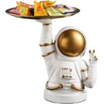 Decorative astronaut figurine holding a tray of colorful candies, perfect for science-themed decor and educational toy displays.