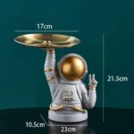 Space-themed astronaut desk organizer featuring a gold helmet and a tray for stationery, measuring 21.5cm tall and 17cm wide, perfect for science decor and educational spaces.