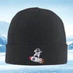 Black knit beanie featuring a cute astronaut riding a rocket patch, perfect for space and science enthusiasts.