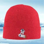 Red knit beanie with astronaut and rocket patch design.