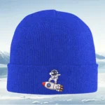 Bright blue knit beanie hat featuring a cute astronaut and rocket ship graphic, perfect for kids and space enthusiasts.