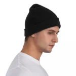 Black knit beanie hat suitable for men and women, perfect for cold weather and outdoor activities.