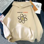 Beige hoodie featuring a black and yellow atomic structure graphic with the text "Quantum Physics" in red, perfect for science enthusiasts and educational settings.