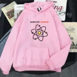 Pink hoodie featuring a black and yellow atom graphic with "Quantum Physics" text. Comfortable casual wear for science enthusiasts and students.