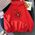 Red hoodie featuring a black atomic model with yellow nucleus, labeled "Quantum Physics" in black and orange text, perfect for science enthusiasts.