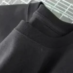 Black crewneck sweatshirt made from soft fabric, ideal for casual outfits and science-inspired decor.