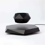 Modern black geometric planter with matching base, ideal for stylish home decor and plant display. Perfect for adding a contemporary touch to any space.