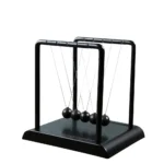 Newton's Cradle desktop physics toy with five swinging metal balls for demonstrating conservation of momentum and energy.