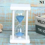 Clear sand timer with blue sand in a white frame, ideal for science experiments, time management, and educational decor.