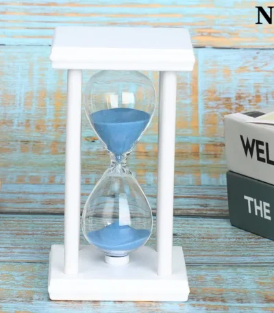 Clear sand timer with blue sand in a white frame, ideal for science experiments, time management, and educational decor.
