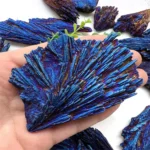 Close-up of a striking blue malachite mineral specimen with layered, fibrous textures and iridescent hues, perfect for science decor or educational displays.