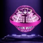 Futuristic pink UFO hover light with geometric cutouts, glowing in a dark setting, showcasing a science-inspired decorative gadget.