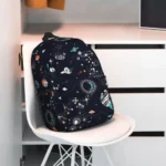 Colorful space-themed backpack featuring planets, stars, and galaxies, perfect for young science enthusiasts.