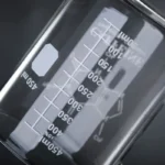 Close-up of a laboratory beaker with measurement markings in milliliters, used for scientific experiments and educational demonstrations.