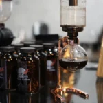 Laboratory setup with glassware and chemical bottles, showcasing science experiments and educational tools for science enthusiasts and students.