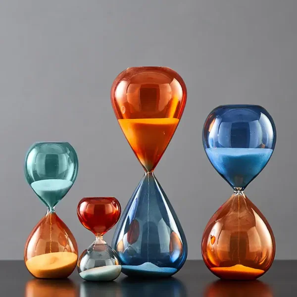 Brightly colored glass hourglasses in various sizes and shapes, perfect for science-themed decor and educational demonstrations.