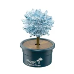 A sparkling crystal tree toy with a plastic pot labeled "Magic Crystal Tree," designed for educational science experiments and decorative purposes.