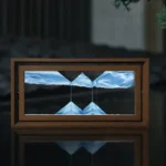 A captivating magnetic levitation display showing two magnetic fields suspending objects in mid-air within a wooden frame.