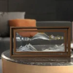 Intricate glass mountain landscape inside a wooden frame, showcasing detailed geological features and reflective surfaces.