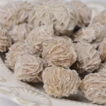 Close-up of frozen ginger root slices showing their textured surface, ideal for culinary use, tea infusions, and natural remedies.