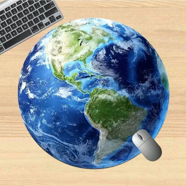 Realistic Earth globe model with a computer mouse and keyboard on a wooden desk, illustrating global technology and education themes.