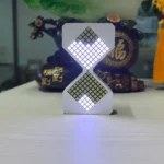 Modern LED hourglass-shaped light with illuminated squares, perfect for home decor or educational purposes.