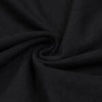 Close-up of black fabric twisted into a spiral, showcasing smooth texture and deep color, ideal for science-themed decor or educational projects.