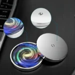 Set of two magnetic galaxy coasters with swirling colorful galaxy design, perfect for protecting surfaces and adding a cosmic touch to your decor.