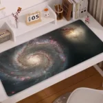 Space-themed galaxy spiral desk mat featuring a stunning cosmic design, perfect for science enthusiasts and adding a cosmic touch to your workspace.