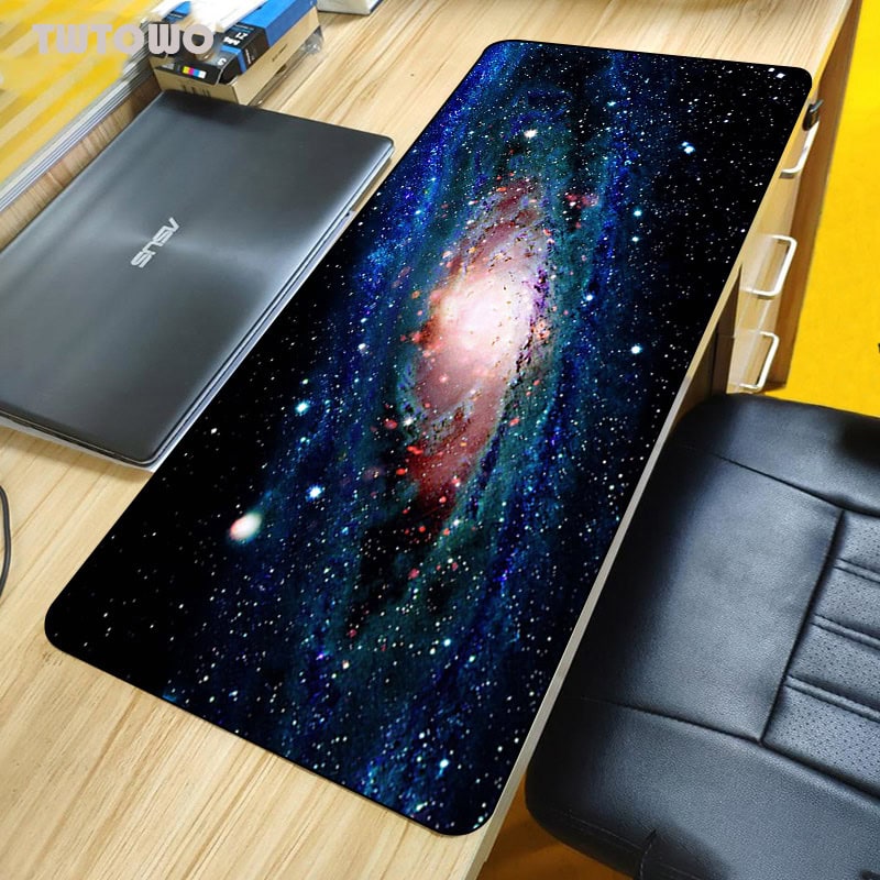 Galaxy Space Desk Mat for Science Decor and Educational Toys A space-themed desk mat featuring a vibrant image of a galaxy with stars and cosmic colors, perfect for science-themed decor and educational settings.