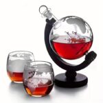 Laboratory glassware with red liquid and ice, scientific experiment setup.