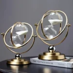 Elegant double-helix hourglass with gold finish, showcasing flowing white sand for a stylish science-inspired decor piece.
