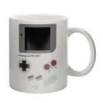 White ceramic mug featuring a detailed print of a classic Nintendo Game Boy handheld gaming console, perfect for gaming enthusiasts and collectors.