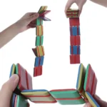 Colorful magnetic building blocks used by children to create various structures, promoting STEM learning and fine motor skills development.