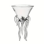 An elegant glass vase designed to resemble an octopus, with tentacle-like extensions at the base, perfect for science-themed decor or educational displays.