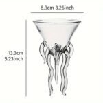 A clear glass vase shaped like an octopus with detailed tentacles, measuring 13.3 cm in height and 8.3 cm in diameter, perfect for science-themed decor or educational displays.