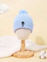 Blue astronaut-themed winter beanie with pom-pom.