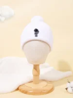 Astronaut-themed white beanie hat with embroidered astronaut design.