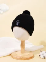 Black beanie hat featuring a small science-themed logo embroidered on the front, perfect for cold weather and science enthusiasts.